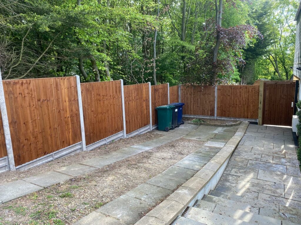 Newly installed Closeboard fence panels with concrete posts and gravel boards.